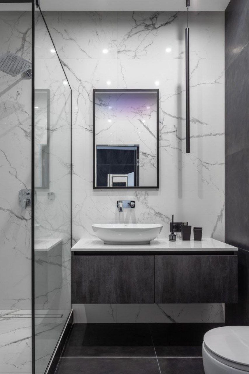 خدمة تصميم داكن بلمسة رخامية ضمن قسم مغاسل